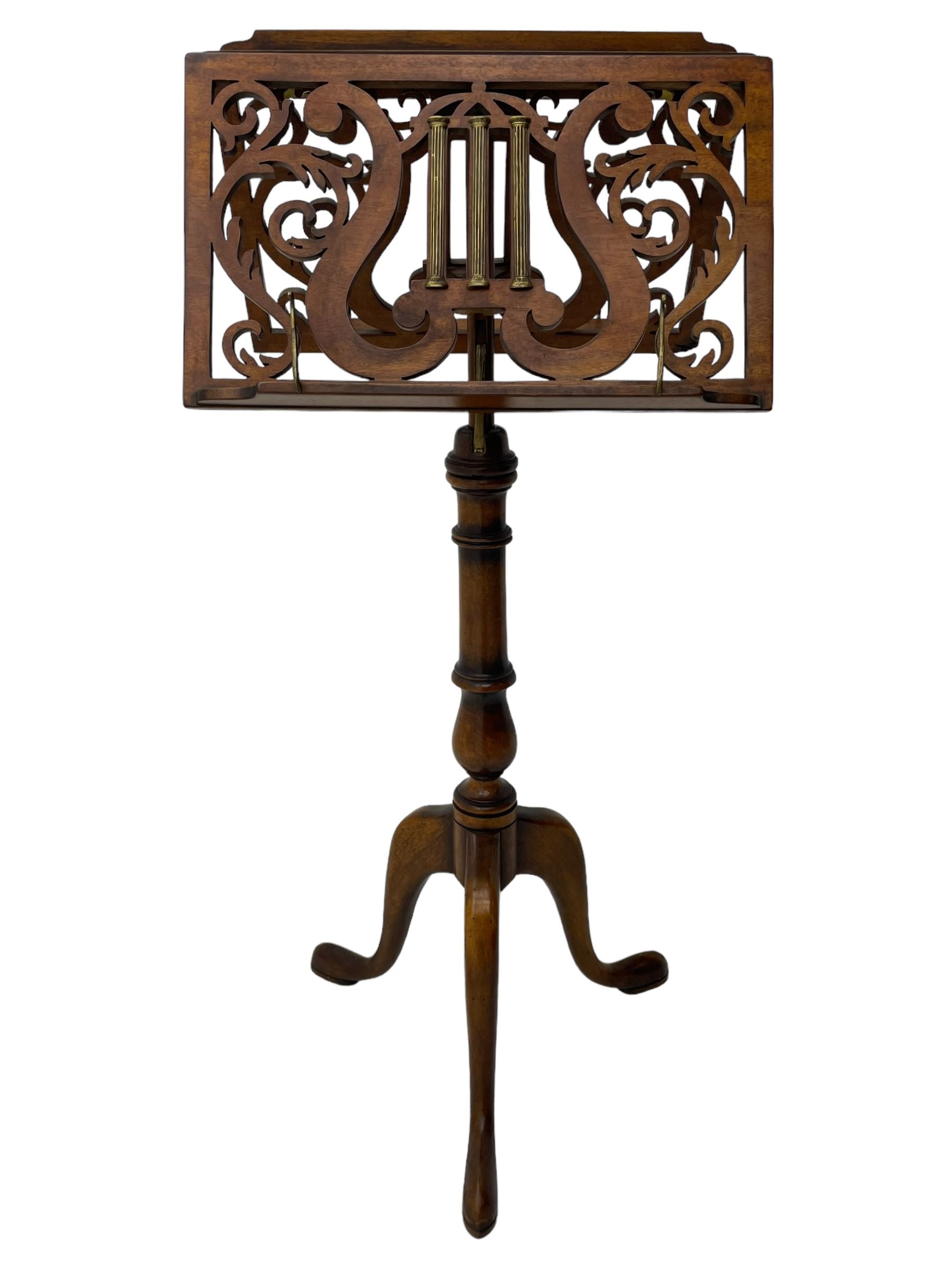 Regency design mahogany duet music stand, double-sided hinged and adjustable reading stands, scrolling leafy branch fretwork with scrolled lyre, fitted with gilt metal reeded columns, on adjustable stem, turned pedestal with tall splayed supports 