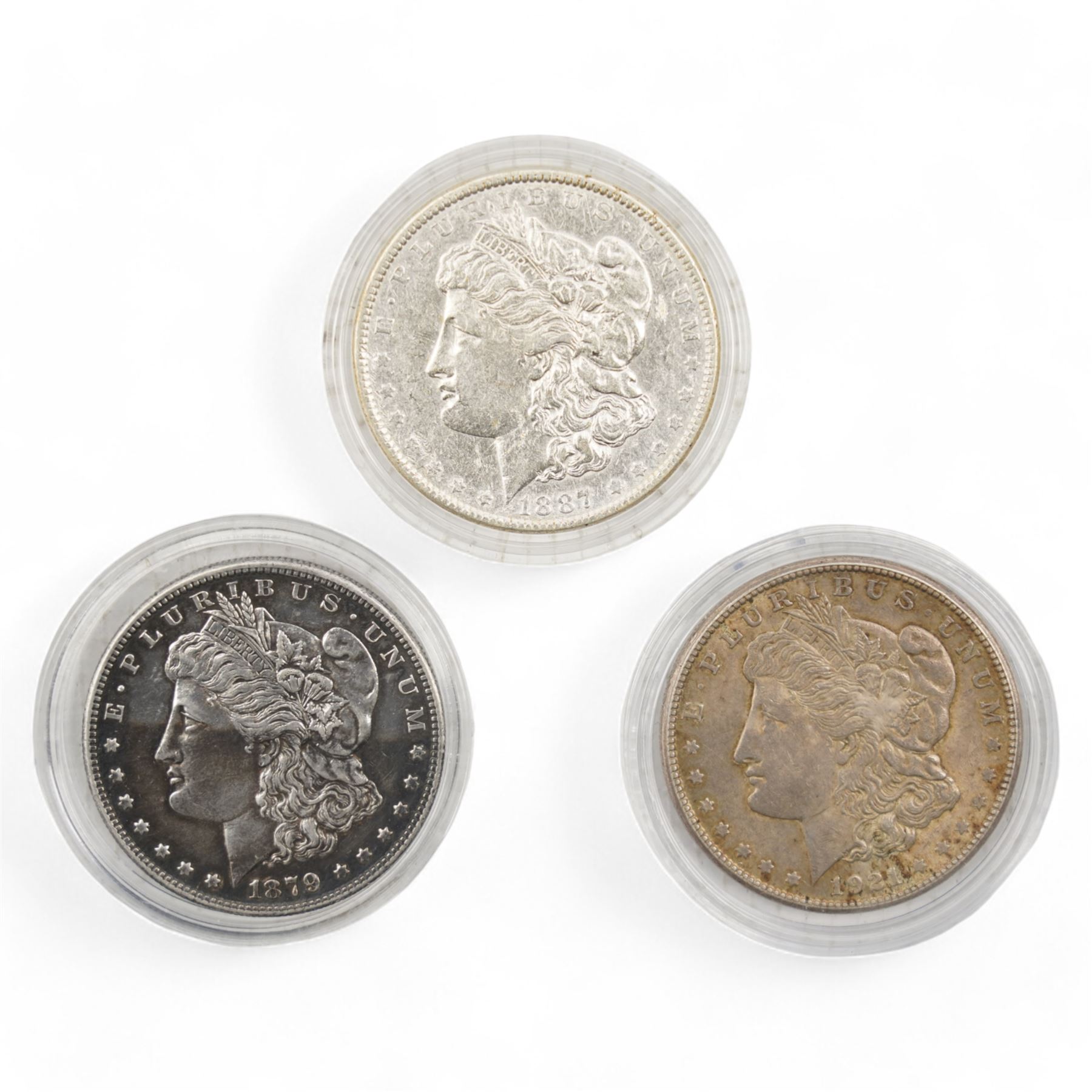 Three United States of America silver Morgan dollar coins, dated 1879S, 1887 and 1921S