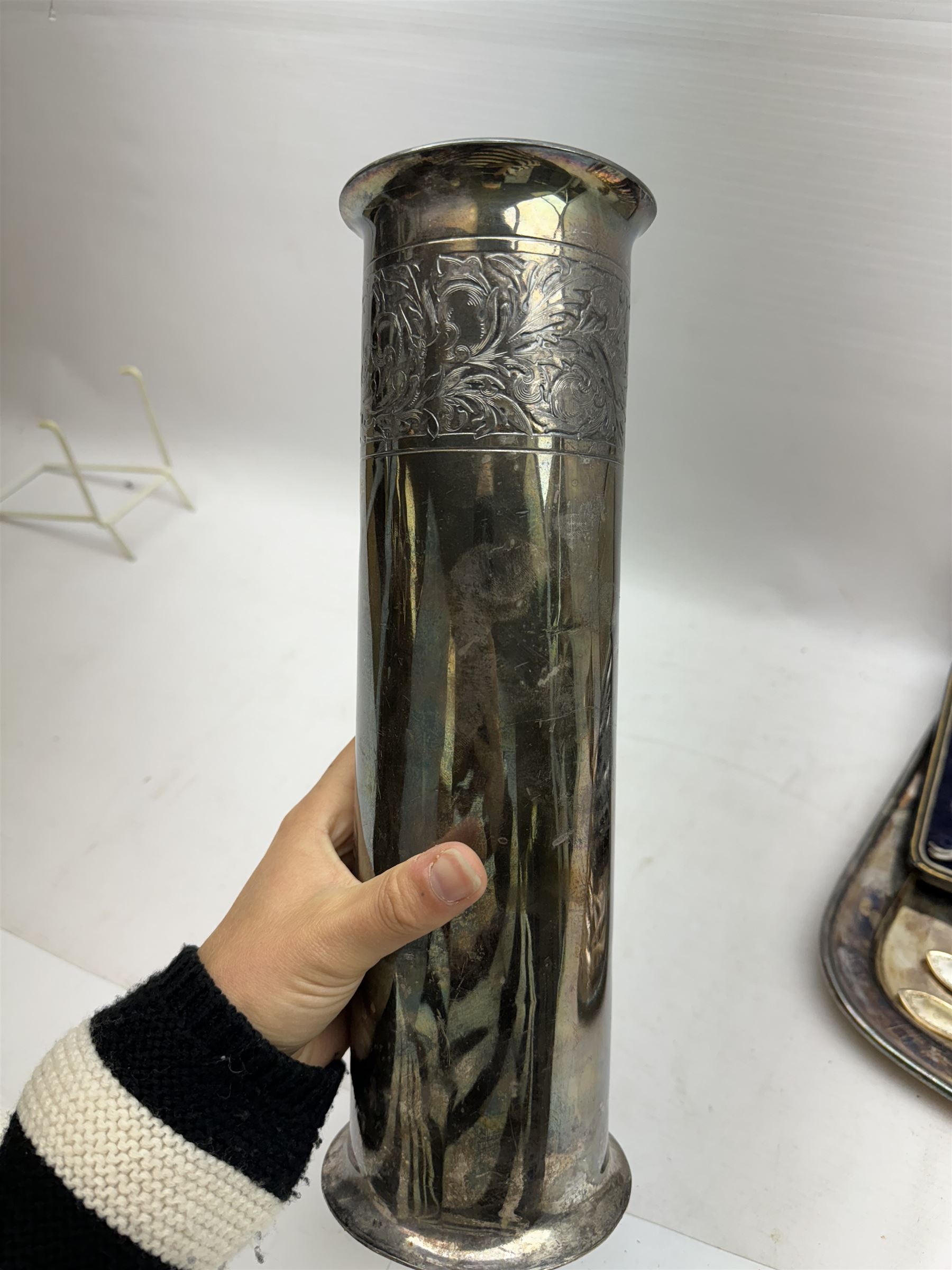 Group of silver plate, comprising vase of cylindrical form, H30.5cm, cream jug of helmet form, including handle H18.5cm, tray of oblong form, L35.5cm, and cased set of six lobster picks