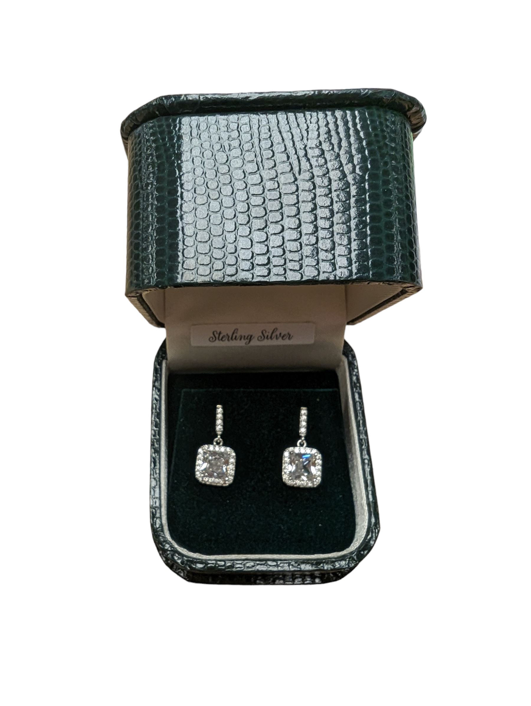 Pair of silver cubic zirconia pendant stud earrings, stamped 925, boxed