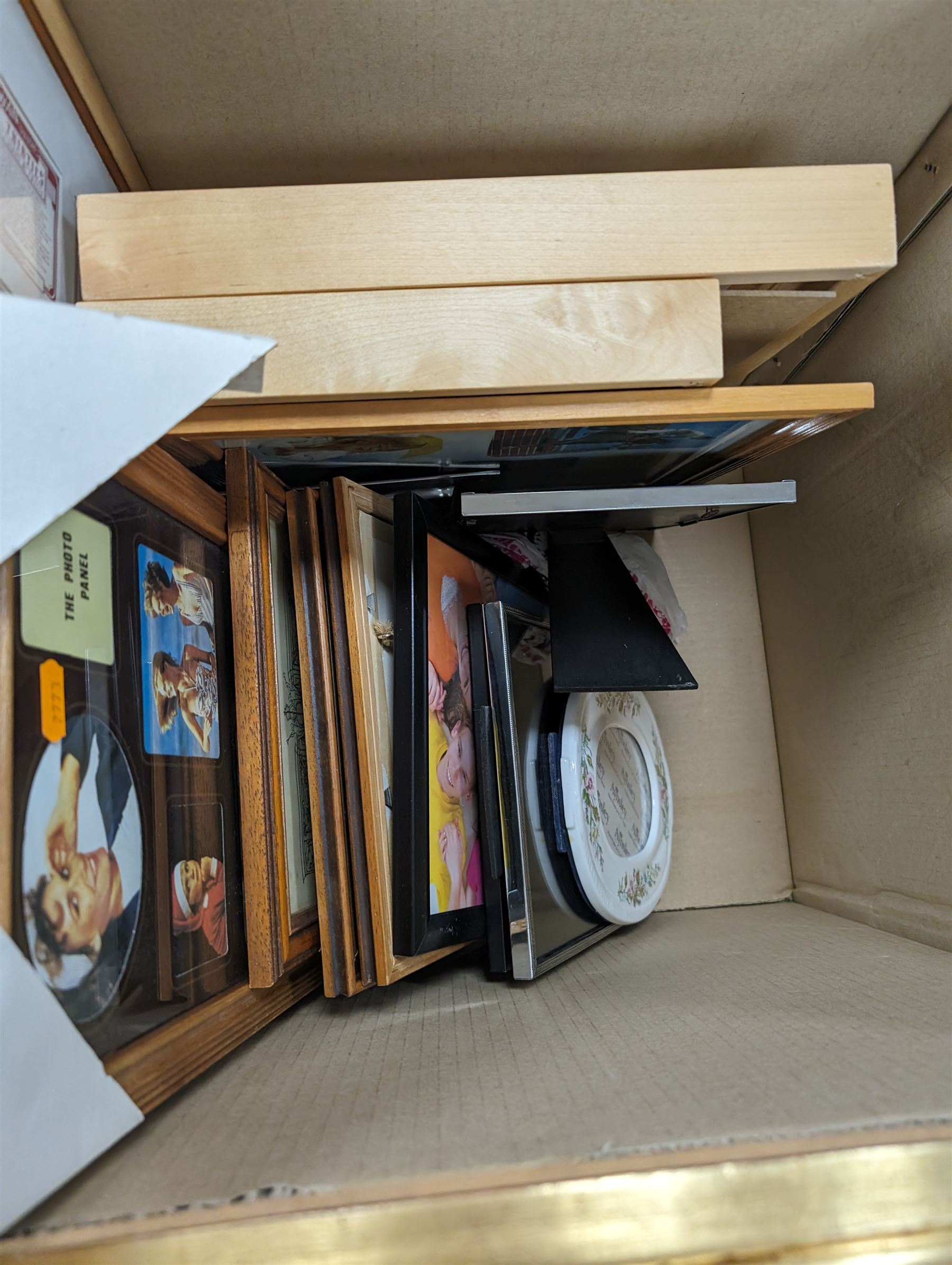 Three modern gilt wall mirrors and two boxes of photograph frames