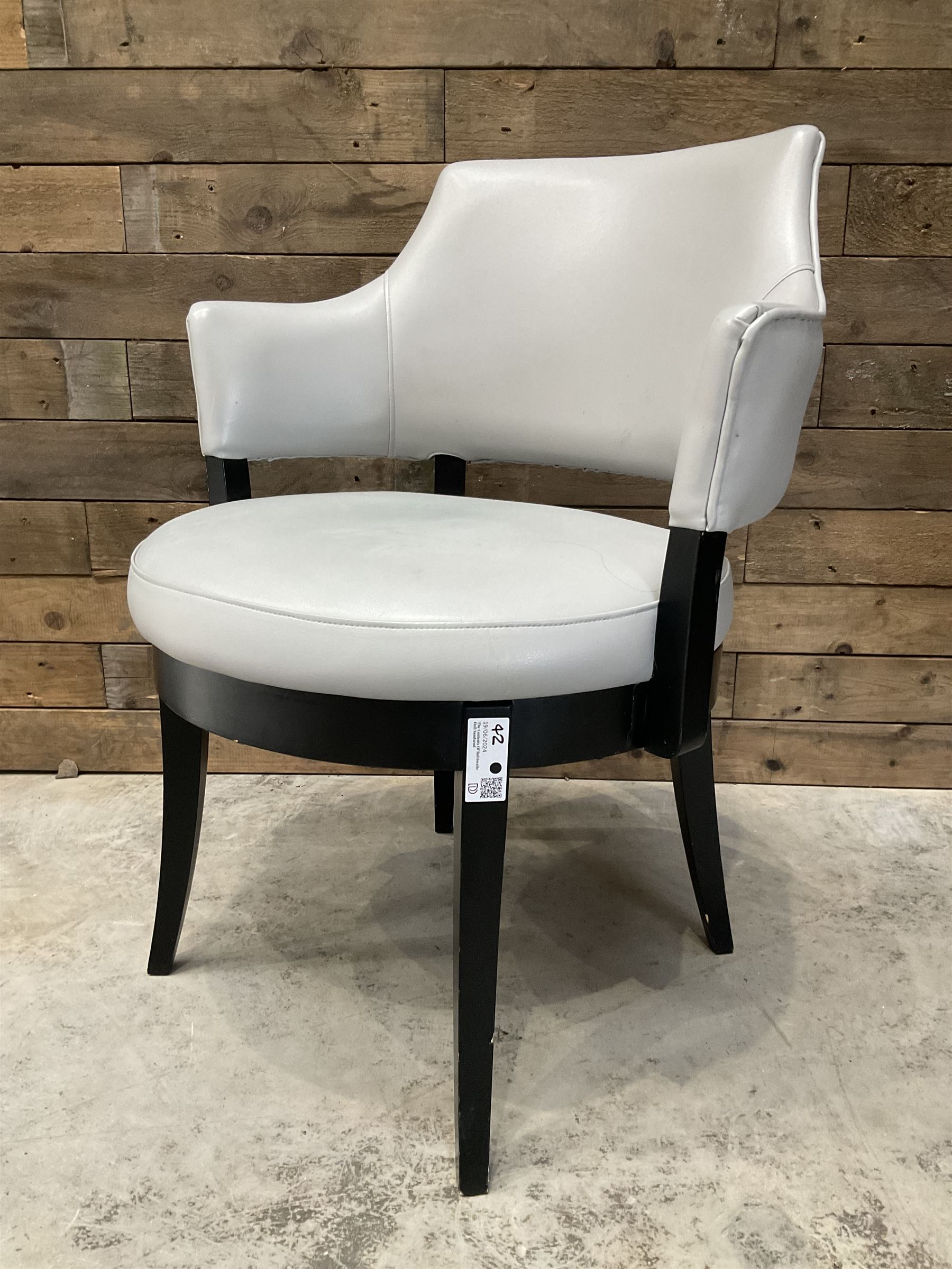 Four ebonised framed tub shaped armchairs, upholstered in grey fabric