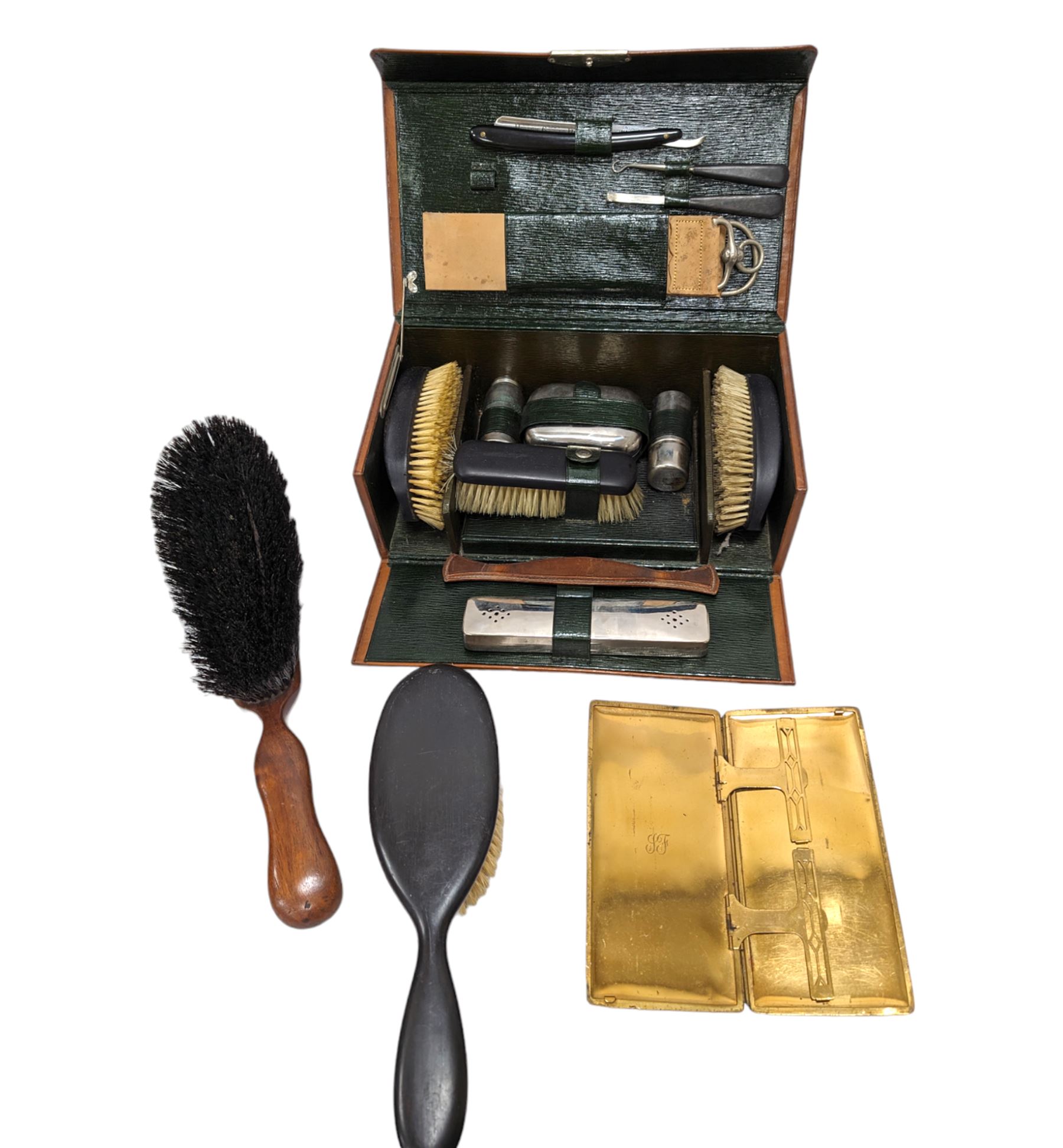 Gentleman's vanity set, containing ebony brushes, chrome jars and bottles, within fitted leather carrycase, together with two other similar brushes 