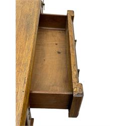 Late Victorian oak twin pedestal desk, chamfered rectangular top over three convex front edge drawers and two panelled cupboards, flanked by carved supports with roundels and diamond motif, on bracketed plinth base