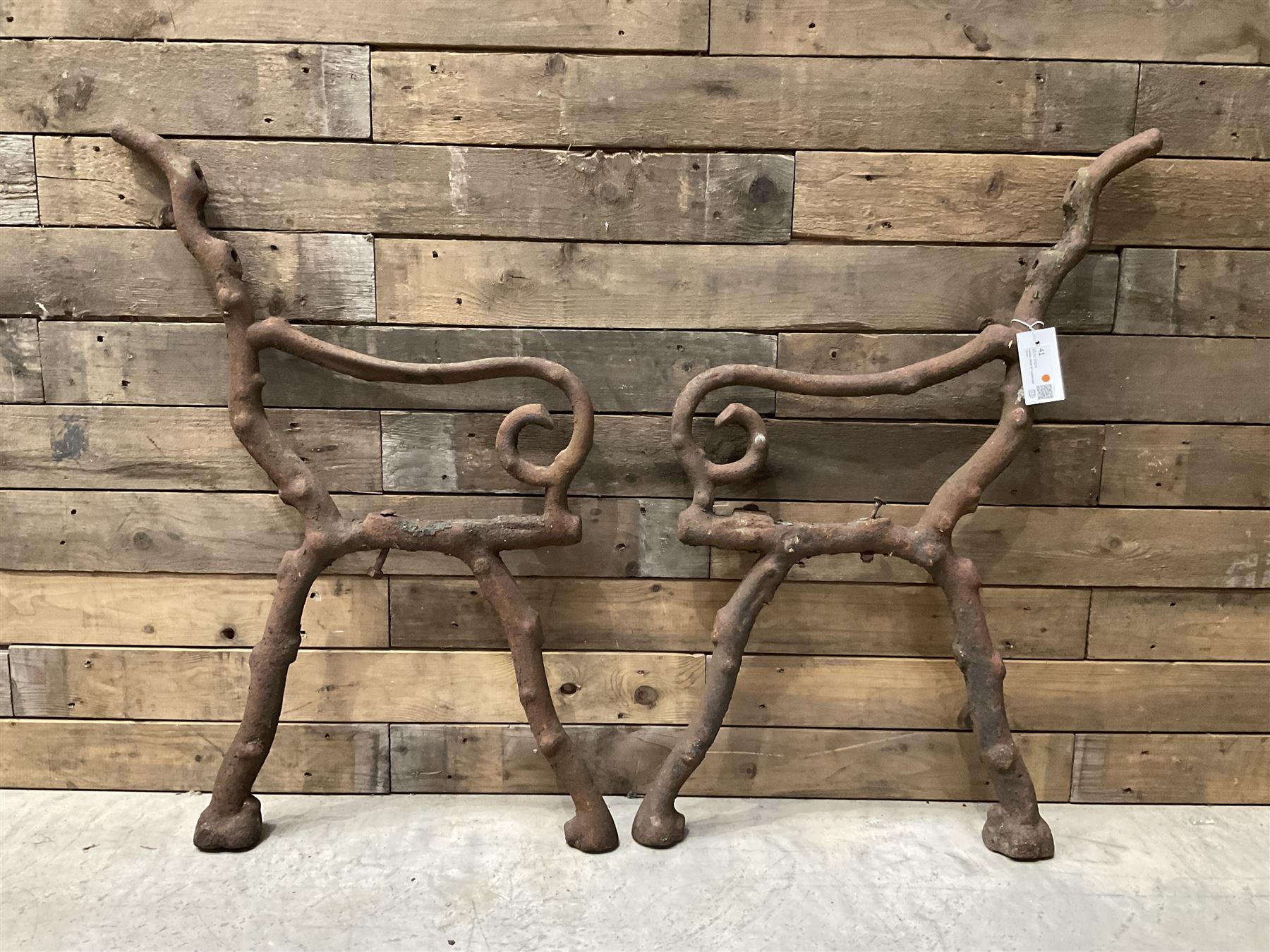 Pair of faux bois cast metal bench ends; together with wooden slatted bench with metal ends