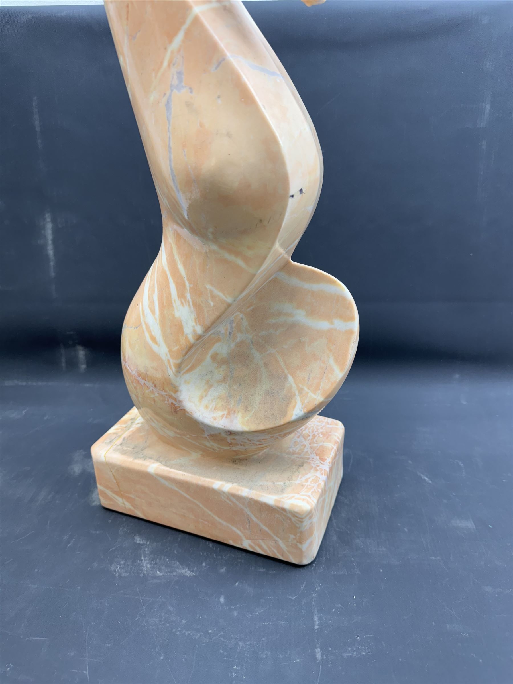 Abstract pink marble sculpture, upon a rectangular base, H63cm