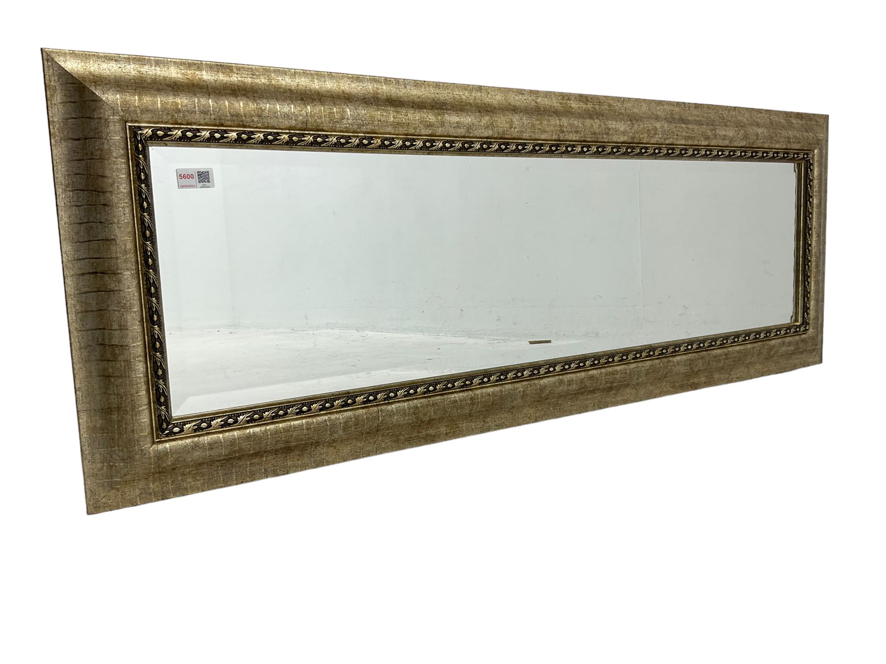 Rectangular wall mirror in gilt famed, bevelled glass plate