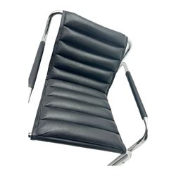 Baroumand Designs - pair of mid 20th century modernist armchairs, slung black leather seat with horizontal channel tufting, tubular chrome frame with curved arms, raised on tubular supports