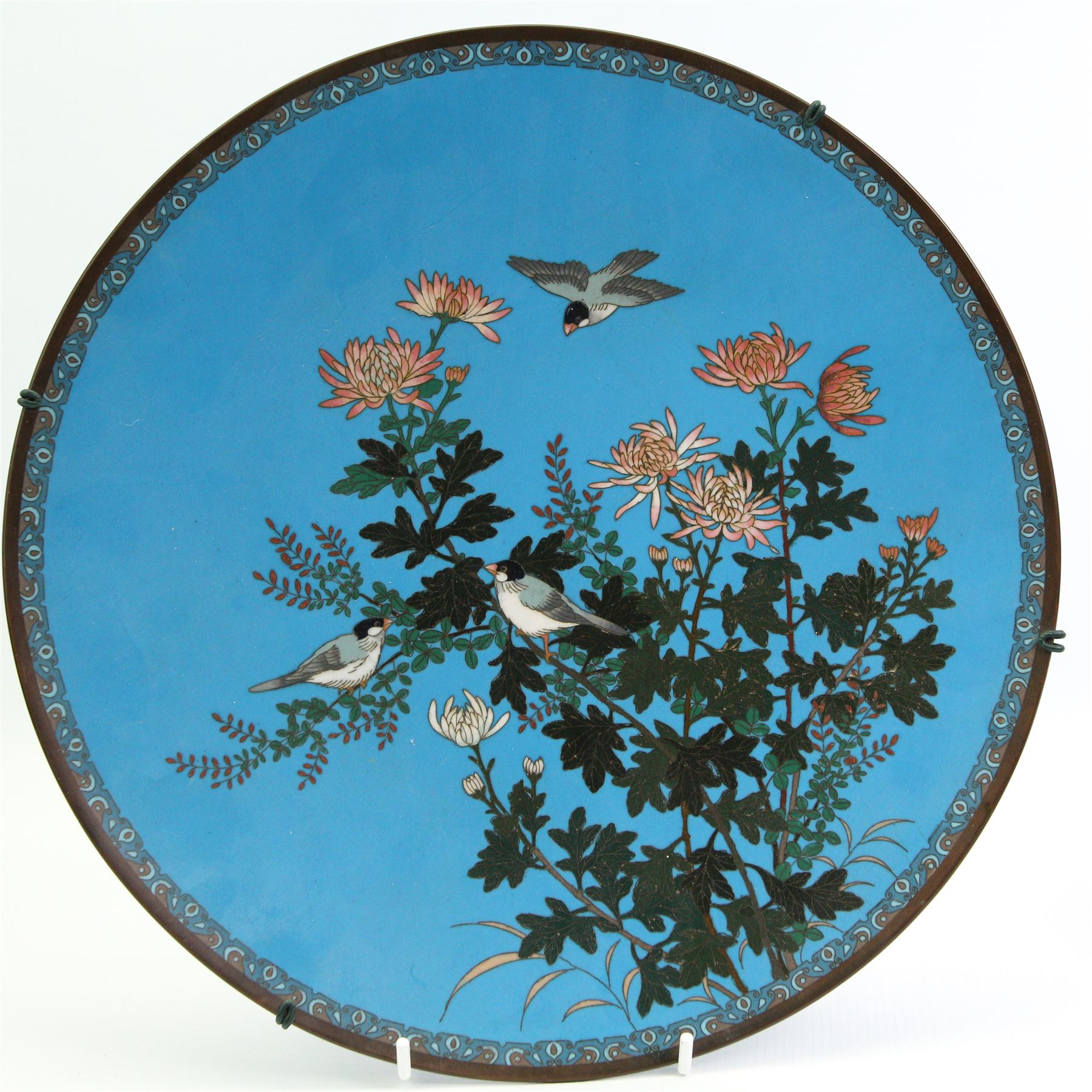 Chinese cloisonne plate, centrally decorated with birds perched on a blossoming tree, D30.5cm, a similar circular wall plaque, decorated with a Crane, together with a pair of Cloisonne green ground vases (4)