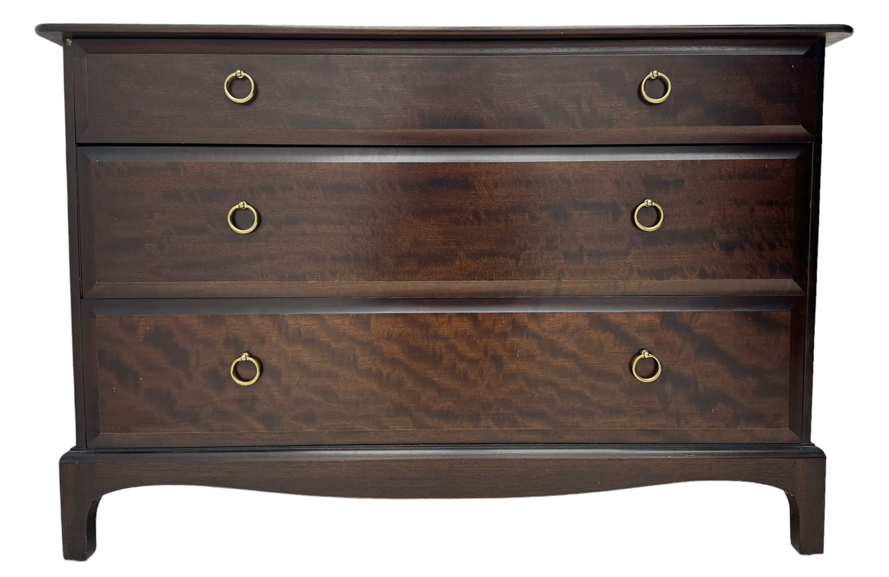 Stag Minstrel - mahogany chest of drawers, rectangular top over three drawers with brass ring pulls, on bracket feet