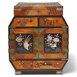 19th/ early 20th century Japanese parquetry and lacquer table cabinet, the brass mounted double doors  inlaid in mother-of-pearl, with a scene of a bird amongst branches, against a black lacquer ground, opening to an arrangement of six drawers, the top with hinged cover, and three further drawers, H36cm, D14cm, W29cm