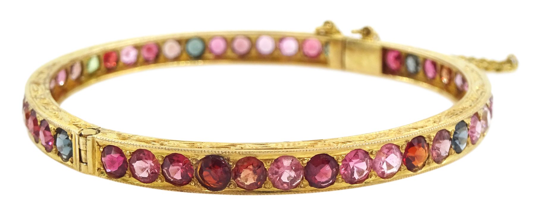 19ct gold multi gemstone hinged bangle, including topaz and tourmaline, the sides with bright cut decoration