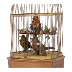 Late 19th century coin operated trio of singing birds in cage automaton, probably by J Phalibois, French, the three taxidermy birds with moving heads, beaks and tail feathers synchronized to the birdsong, under a gilt brass cage with one penny coin entry shoot, The gilt canted rectangular base with barbola decoration, H58cm