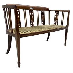 Edwardian inlaid mahogany two-seat salon sofa, curved back and arms inlaid with boxwood stringing, vertical slat back with pierced splats inlaid with satinwood, upholstered seat, on square tapering front supports with spade feet 