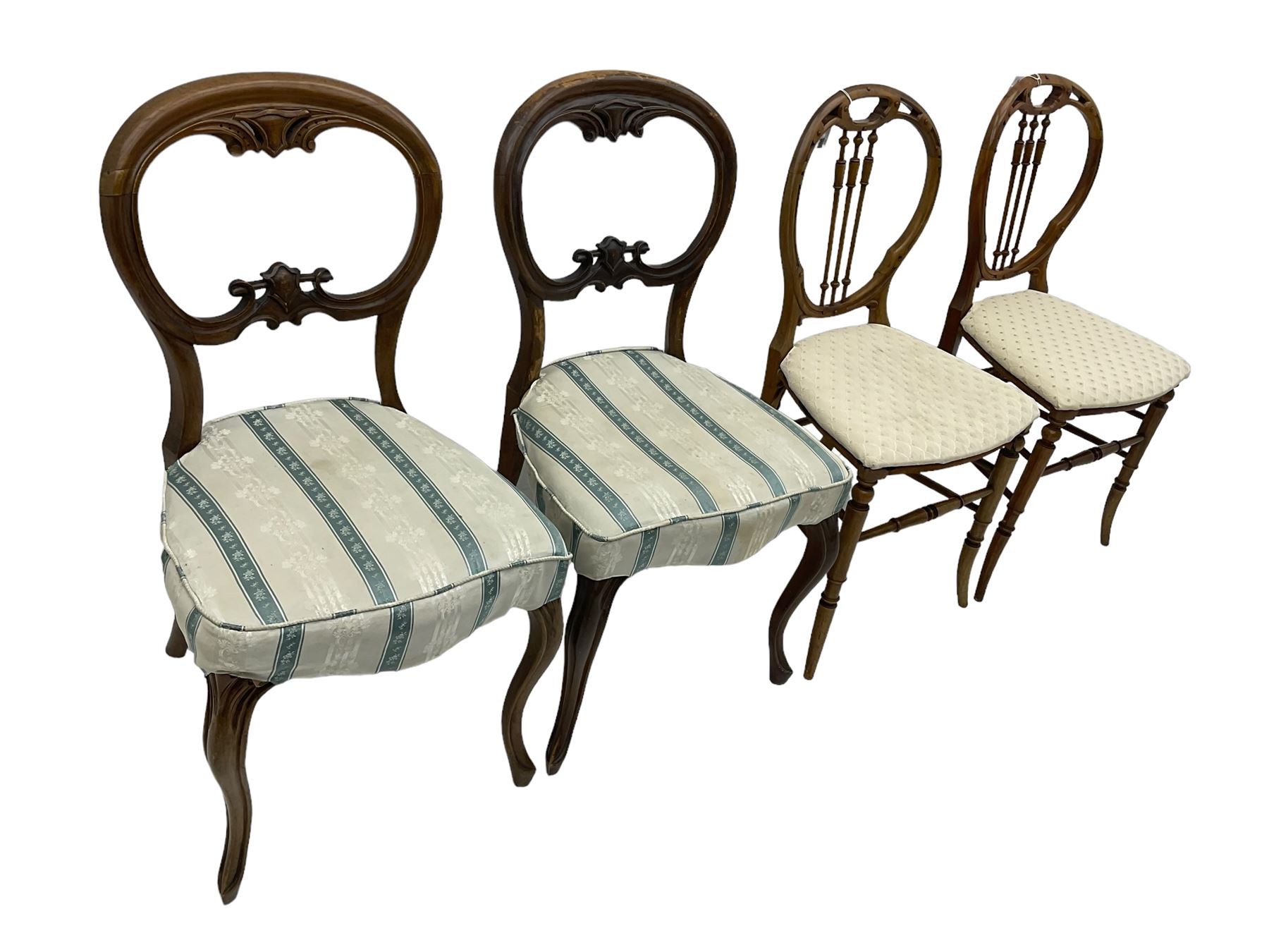 Pair of Victorian walnut balloon back dining chairs, scrolled and pierced cresting rail over cartouche carved middle rail, upholstered seats on cabriole supports; pair of Victorian walnut balloon back bedroom chairs, pierced cresting rail over turned spindle back, drop-on seat cushion over cane seat on turned supports united by turned stretchers (4)