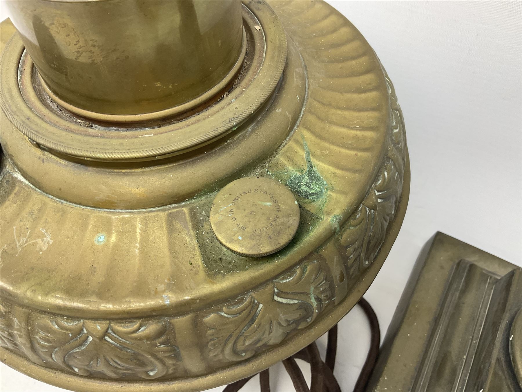 Victorian brass oil lamp converted to electricity, the square stepped base with a reeded doric column leading to a cut clear glass reservoir and burner and spherical shade with printed bird decoration, together with another similar shade and oil lamp parts and accessories etc