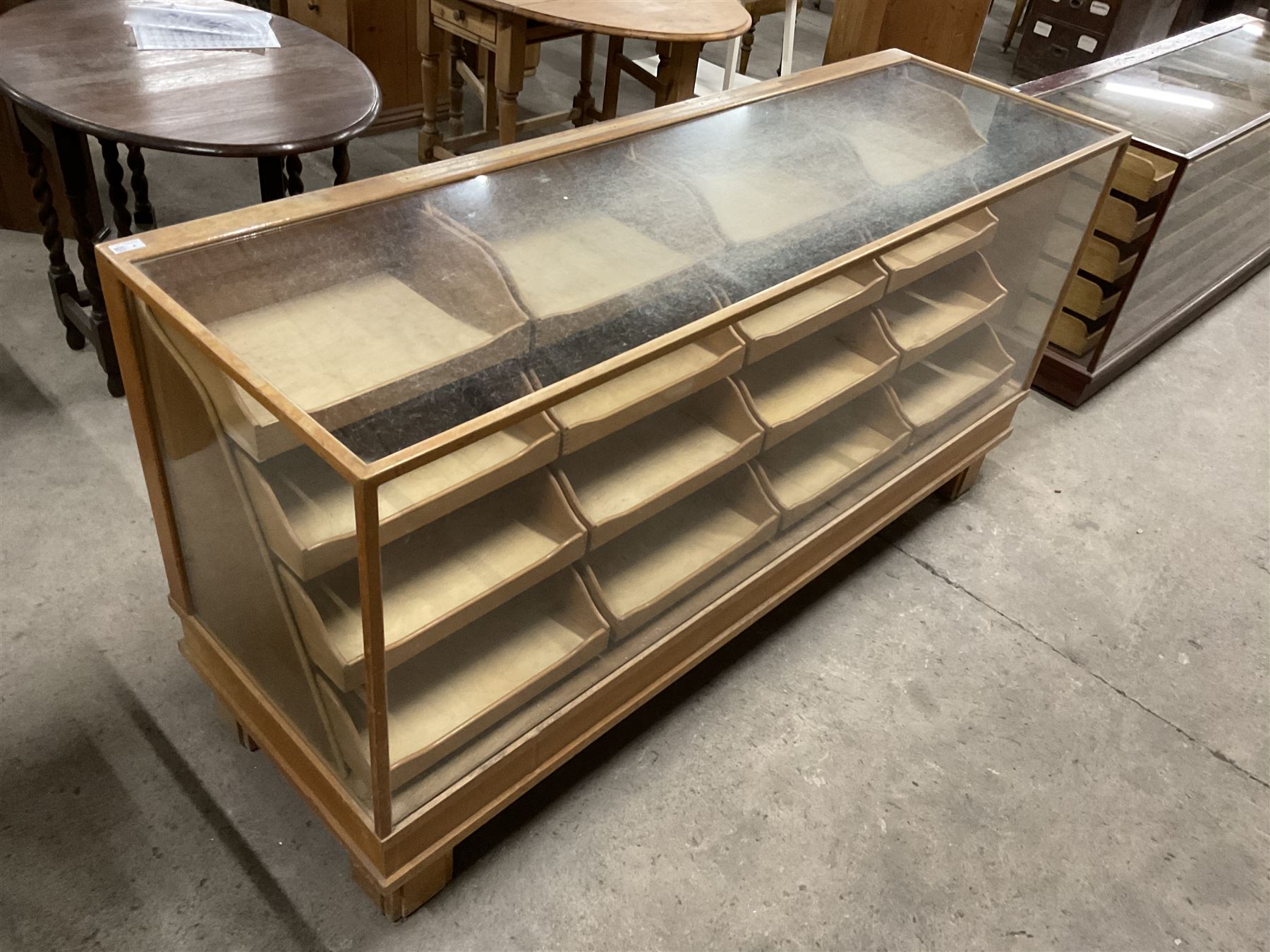 20th century oak and glazed haberdashery shop’s cabinet, glass front and sides, fitted with sixteen graduating drawers  - THIS LOT IS TO BE COLLECTED BY APPOINTMENT FROM THE OLD BUFFER DEPOT, MELBOURNE PLACE, SOWERBY, THIRSK, YO7 1QY