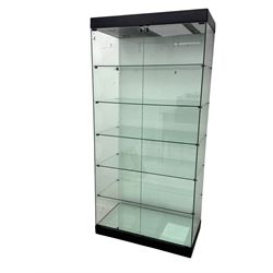 Glazed shop display cabinet fitted with two doors, six shelves with illuminated interior