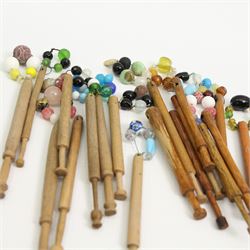 Collection of turned wooden lace maker's bobbins, including 19th century and later examples, mostly with glass spangles and turned shafts (100 approx)