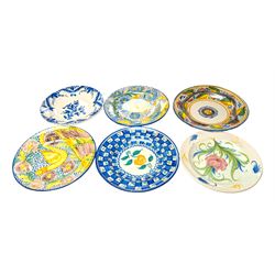 Six Spanish ceramic chargers, painted with bright floral patterns, three marked Lario, largest D35cm