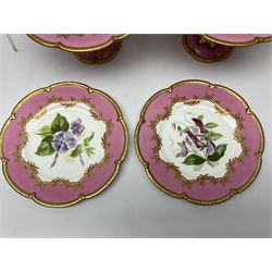 Victorian dessert service, comprising four comports and nine plates, each decorated with floral sprigs to the centre with a pink and gilt border, largest comport H13cm, plate D22.5cm