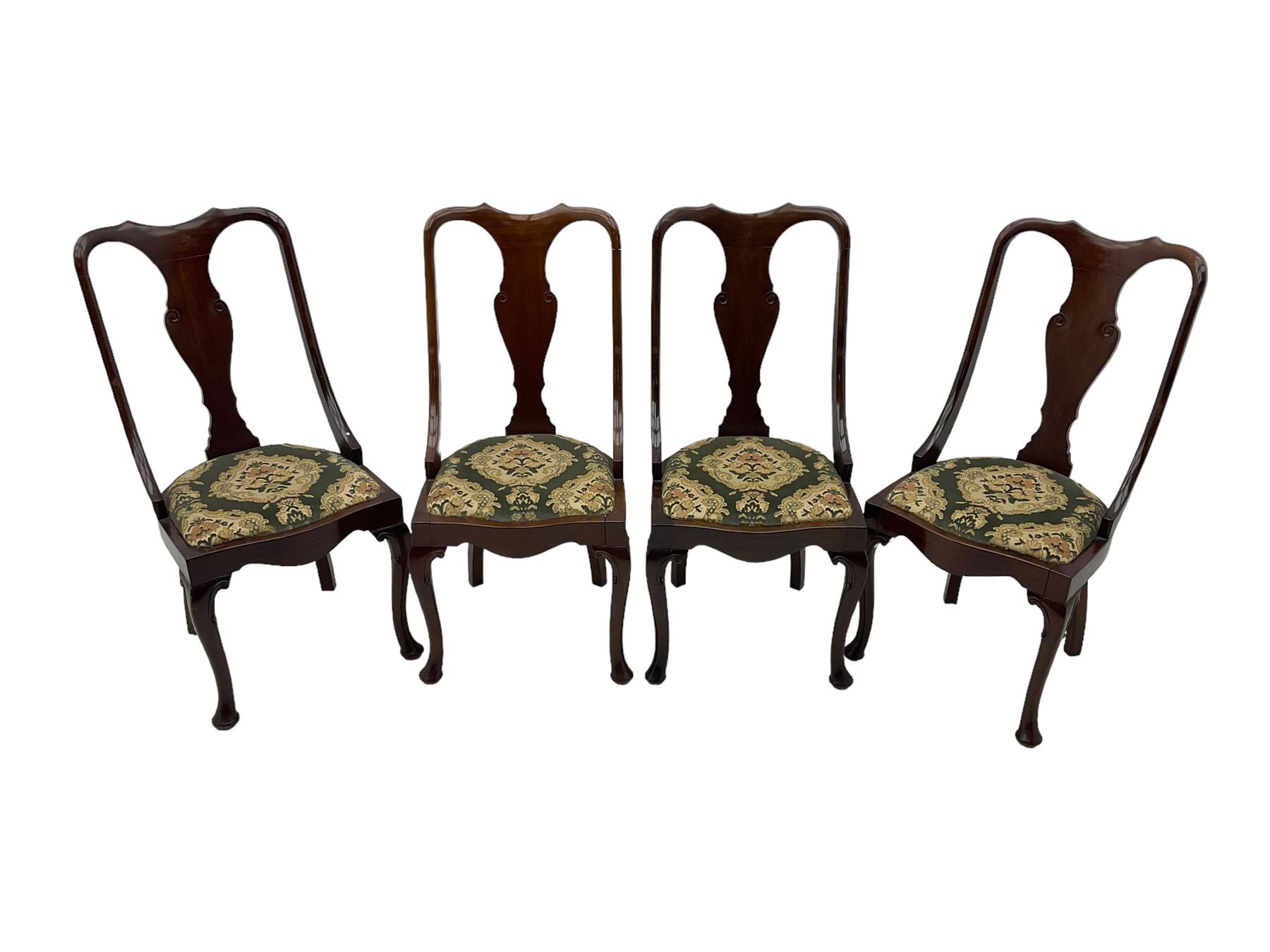 Set of eight late 19th century mahogany spoon back dining chairs, each with shaped top rail over Queen Anne design vase-shaped splat, upholstered seats in floral patterned fabric, raised on cabriole supports with scroll carved knees