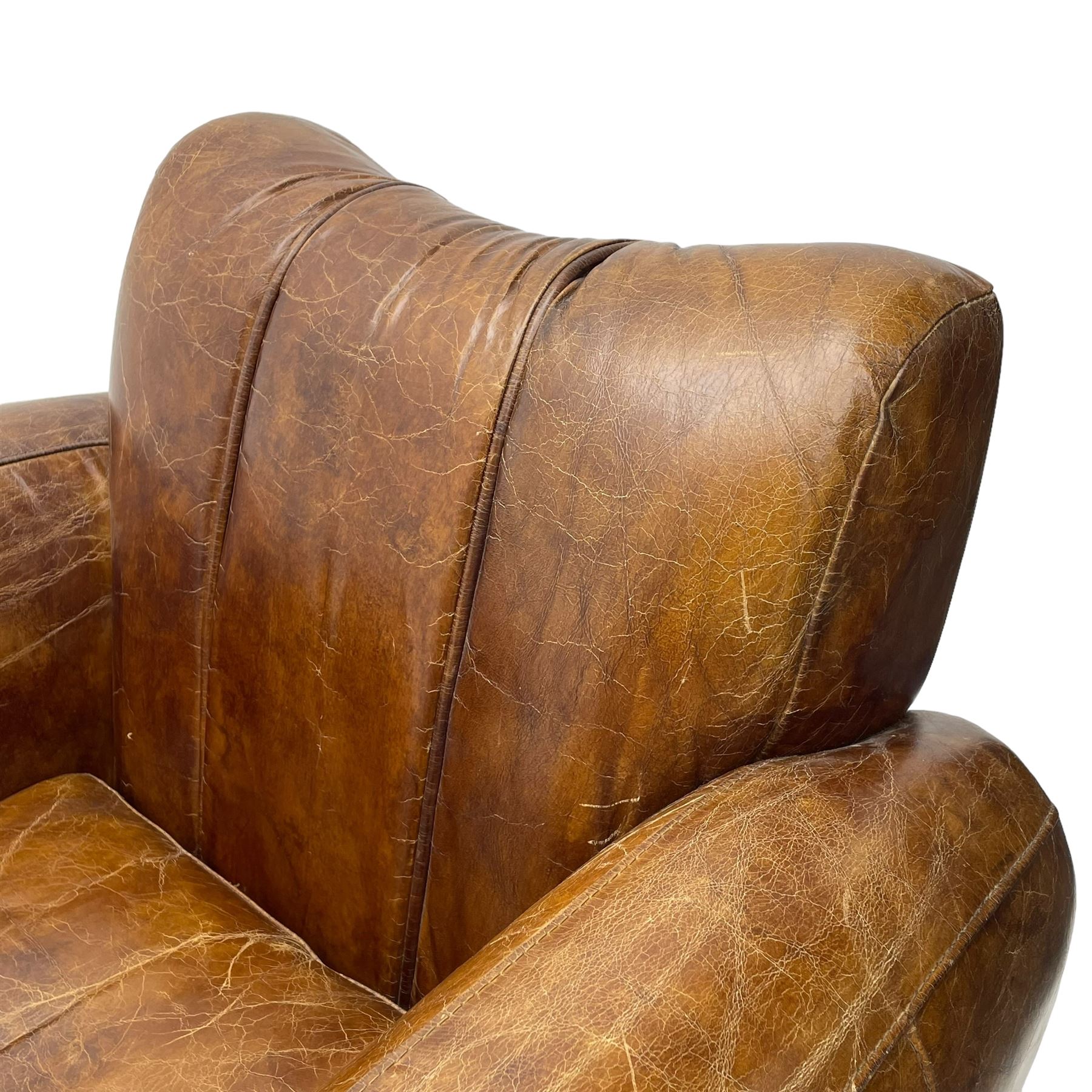 Rockson - club armchair, dished cresting rail over curved arms, upholstered in brown stitched leather, on block feet