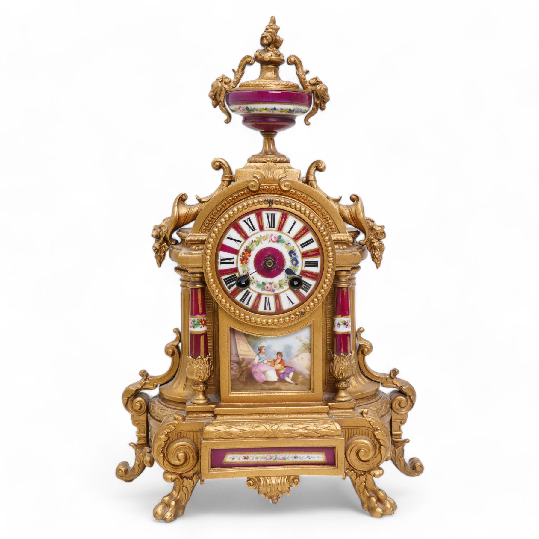 French - Late 19th century 8-day gilt metal and porcelain mounted clock c1880, the arched case above a plinth base on paw feet surmounted by an urn, porcelain dial with cartouche Roman numerals and steel spade hands, twin train rack striking movement, sounding the hours and half hours on a bell. With pendulum. 