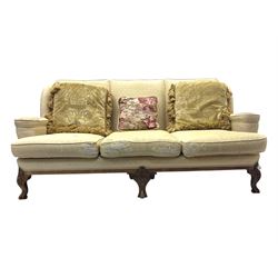 Late 20th century mahogany framed three seat sofa, upholstered in cream fabric with repeating cross pattern, raised on cabriole supports (W192cm, D98cm, H89cm); matching armchair in light pink fabric (W92cm, D98cm, H89cm) 