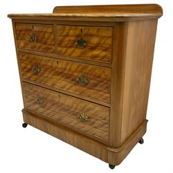 Victorian satin walnut chest, raised back over two short and two long drawers, skirted base with castors