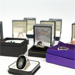 Twelve silver gemset rings, including a jet ring with Celtic design shoulders and a garnet two row cluster ring, amethyst cluster ring and an early 20th century citrine ring