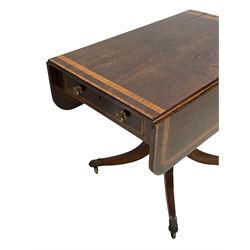 Early 19th century mahogany Pembroke table, rectangular drop-leaf top with rounded corners inlaid satinwood bands, single end drawer and opposing false drawer, turned pedestal on four acanthus carved and reed moulded splayed supports, cast brass cups and castors 