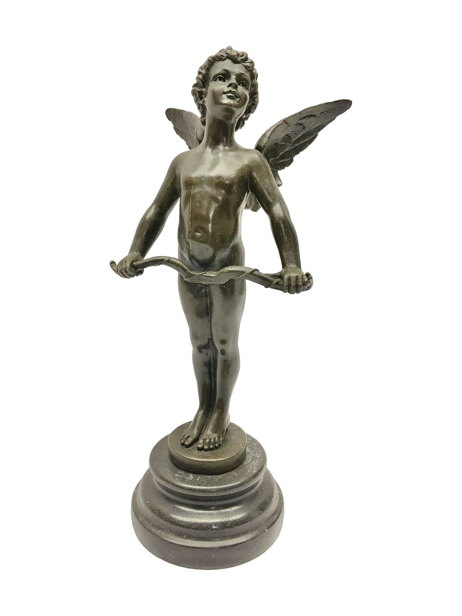 After Moreau, bronzed figure modeled as an angel holding a bow, with foundry mark upon socle base, H30cm