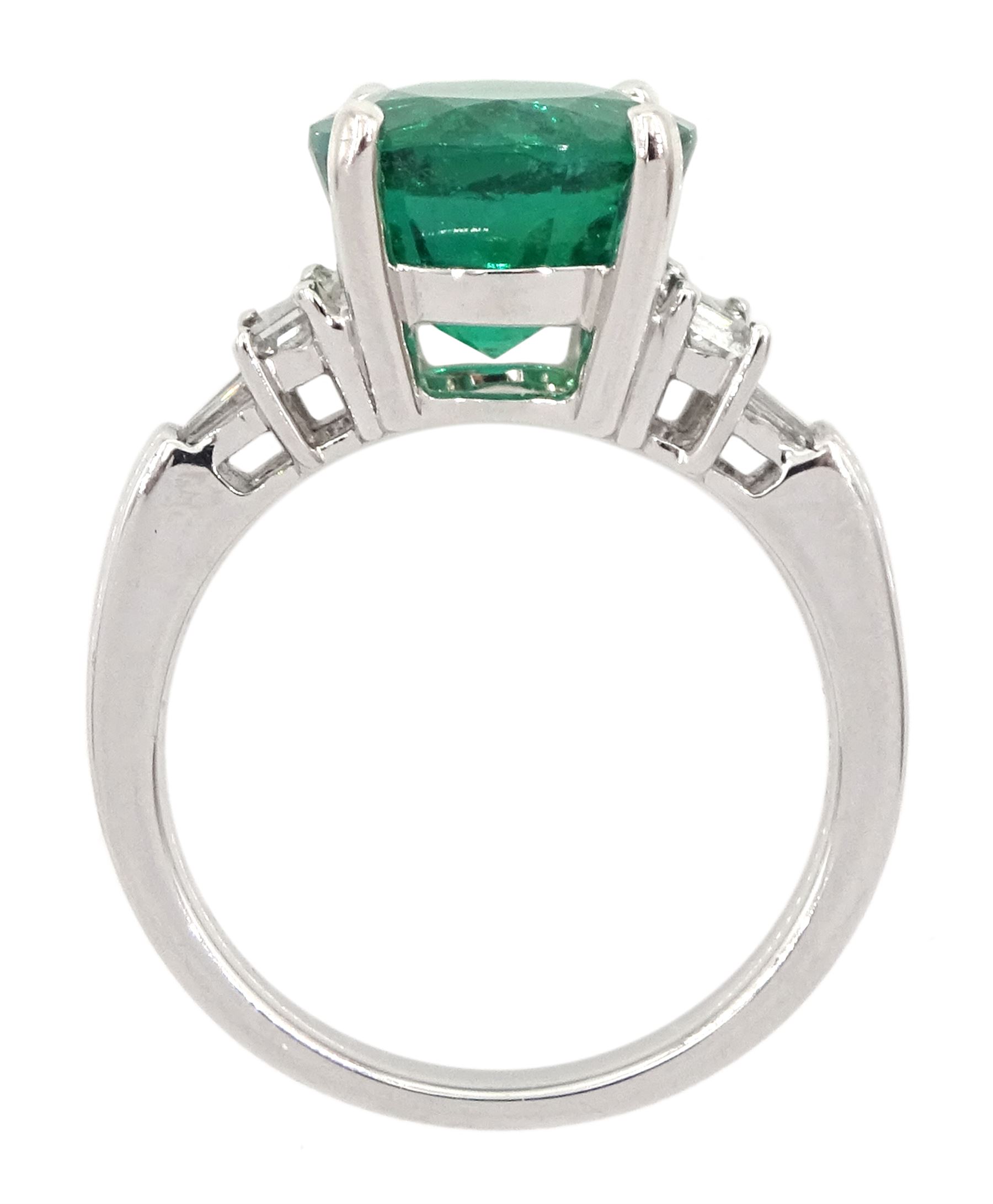 18ct white gold three stone round emerald, baguette and tapered baguette cut diamond ring, hallmarked, emerald approx 3.10 carat