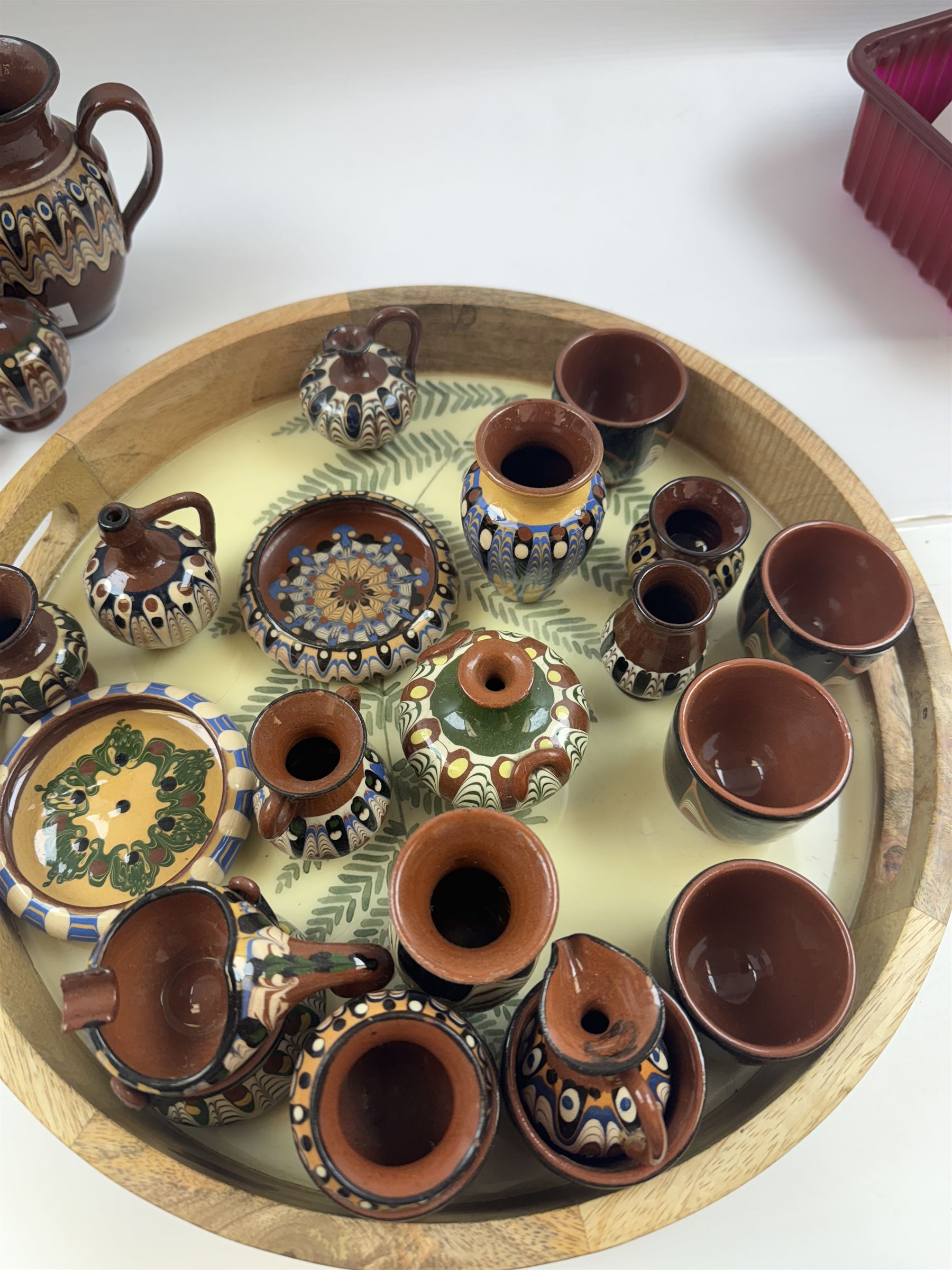 Collection of slipware, including miniature vases, baskets, candlesticks jugs etc 