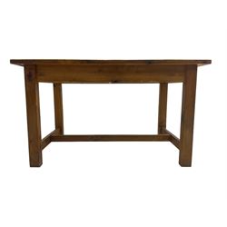 Traditional waxed pine kitchen or dining table, rectangular top over square supports united by H-stretcher