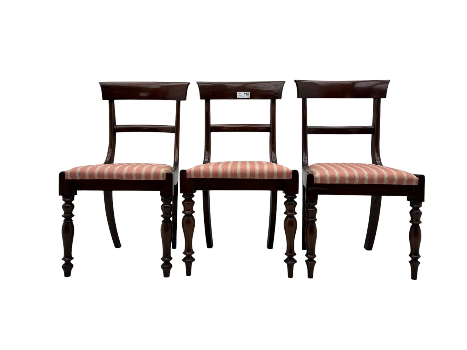 Set of six Victorian mahogany dining chairs, curved bar back over drop-in seat upholstered in striped fabric, on turned front supports