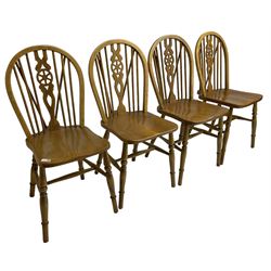 Set of four elm and beech wheelback dining chairs