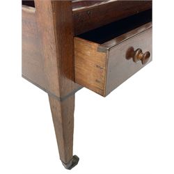 George III mahogany Canterbury, four divisions, fitted with single drawer with turned handles, on square tapering supports with brass cups and castors 