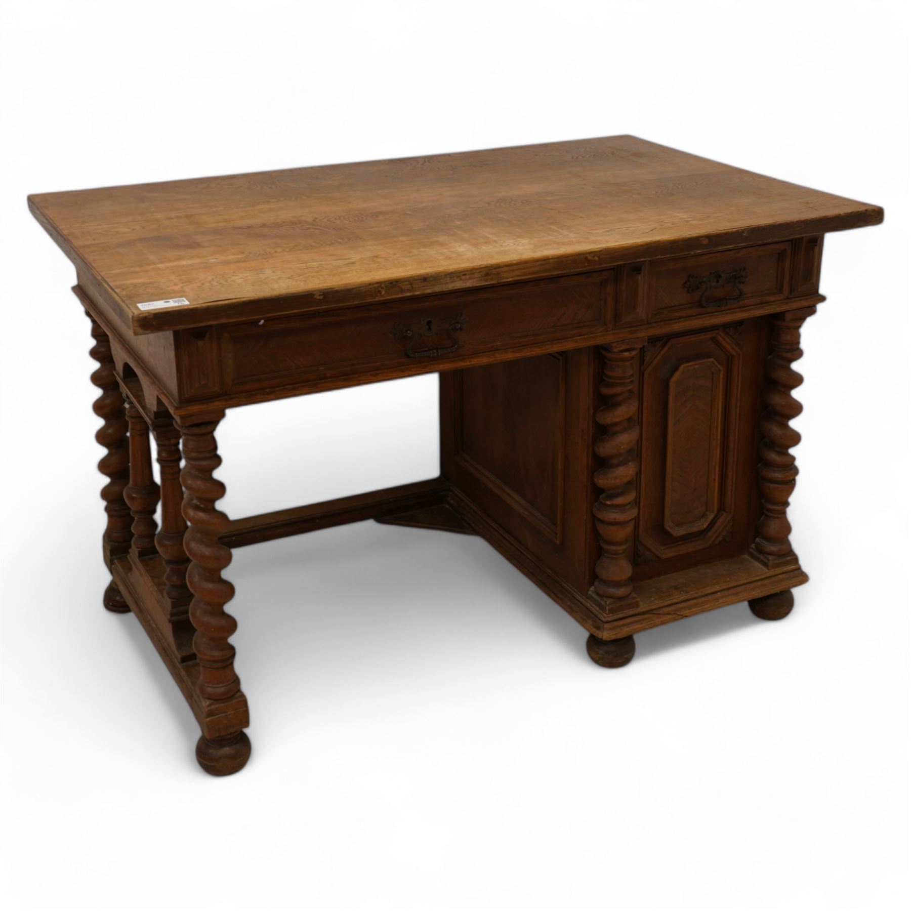 19th century oak desk, rectangular top over two drawers and cupboard, on spiral turned supports and turned bun feet