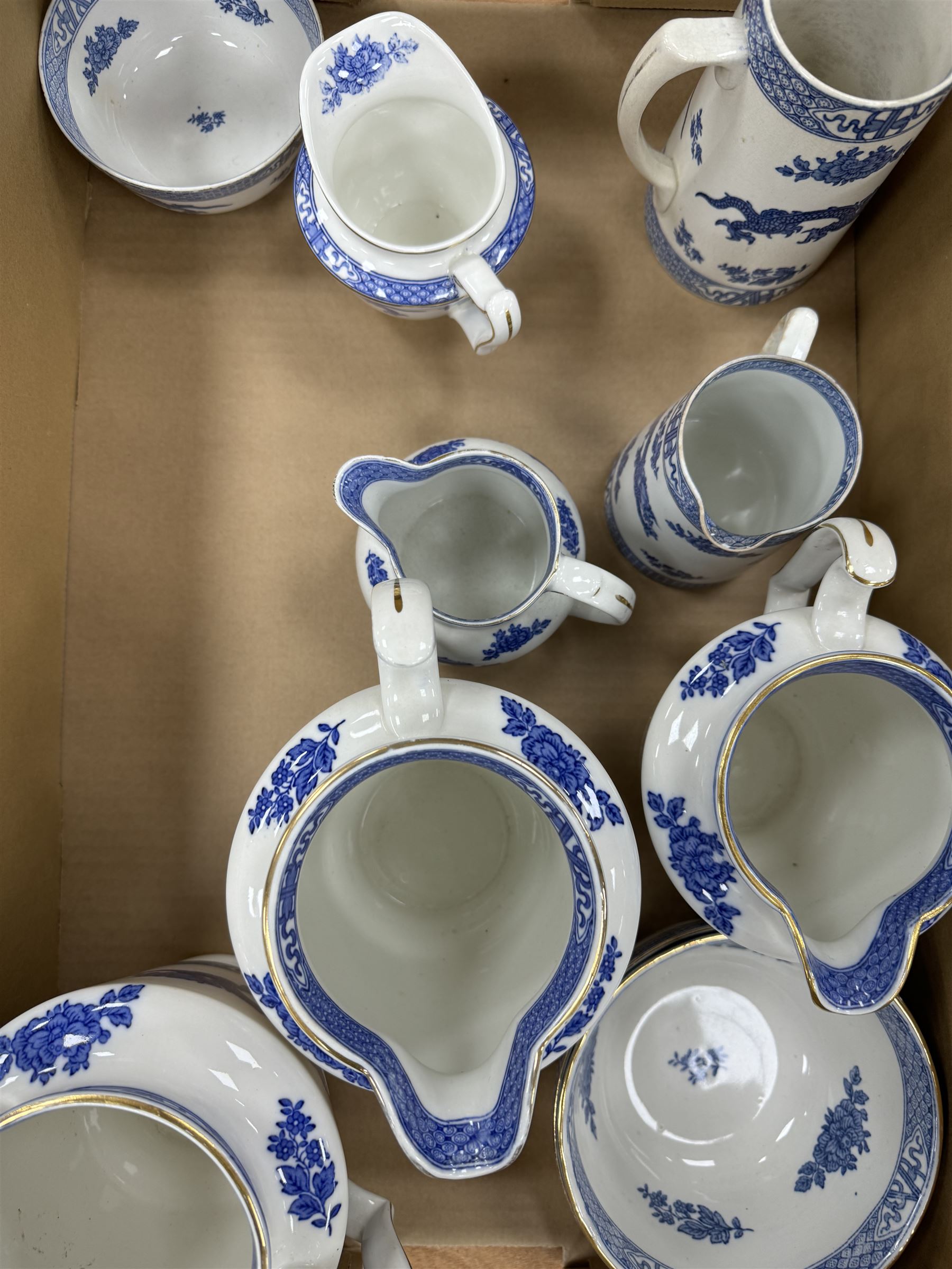 Extensive tea and dinner service of Booths and Cauldon dragon pattern, including, teapots, coffee pots, jugs, toast racks, bowls, dinner plates, platters, soup tureen etc 