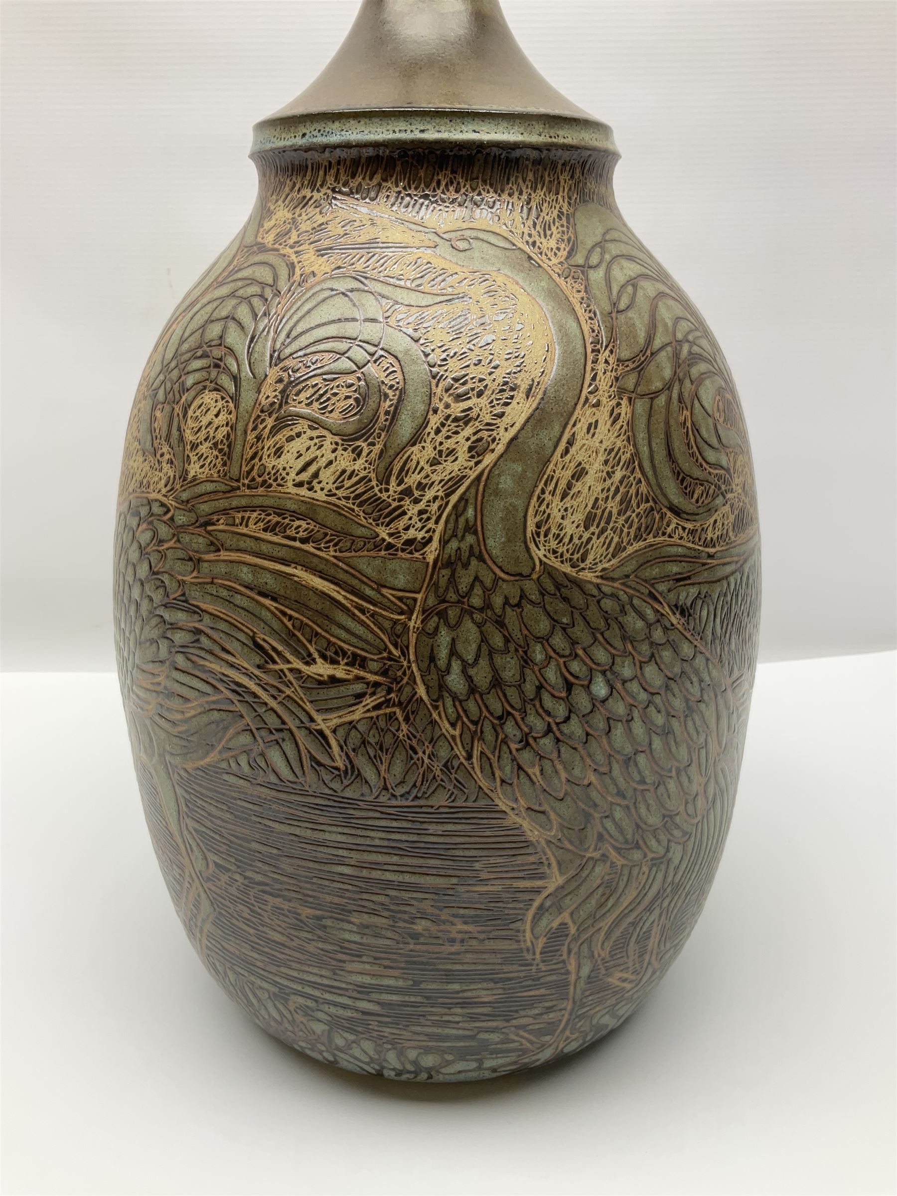 John Egerton (c1945-): studio pottery stoneware lamp base, decorated with cranes in a riverscape upon a mottled brown ground, H51cm