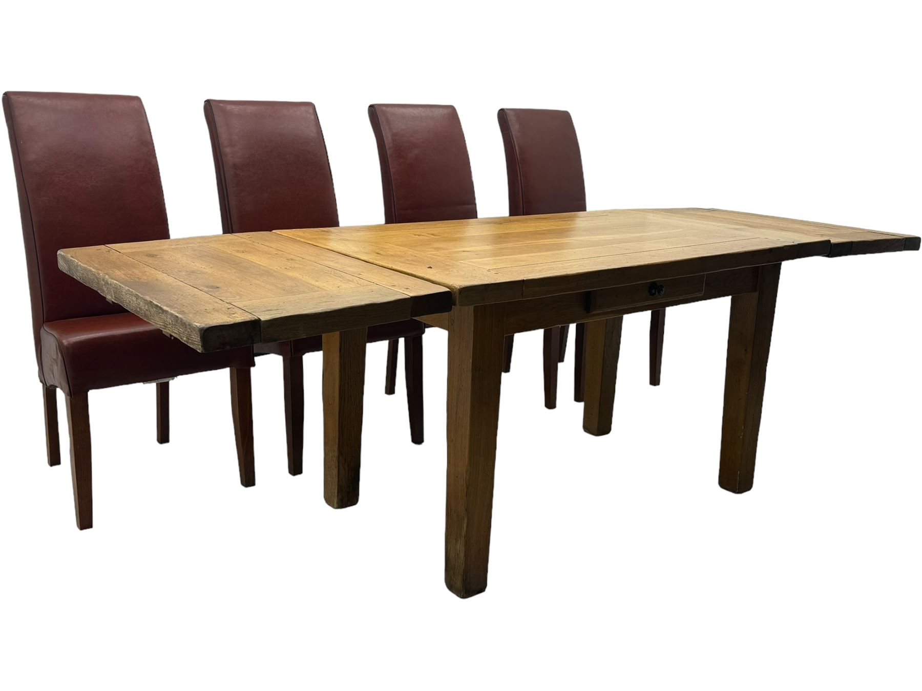 Oak dining table, rectangular plank with two extension leaves at each end, central drawer with brass handle, supported by square legs (L131cm - 233cm, D80cm, H76cm); four high-back dining chairs, the chairs upholstered in dark brown leatherette with stitched detailing, on square tapering legs (H108cm)