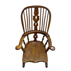 Elm and beech high back Windsor chair,  high hoop back with pierced splat and spindle supports over shaped saddle seat, raised on ring turned supports united by H-stretcher