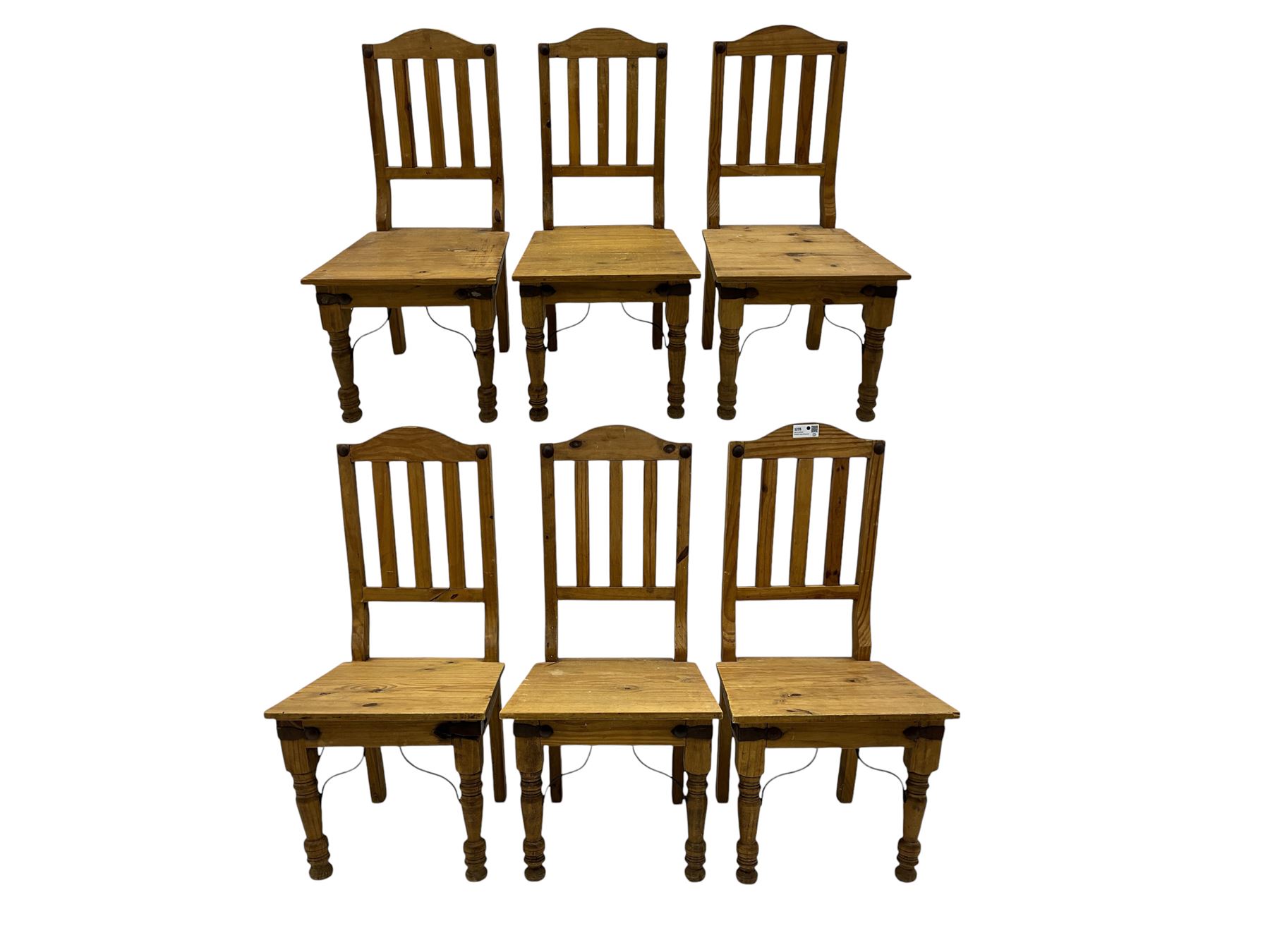 Set of six waxed pine dining chairs, shaped cresting over vertical slat back, plank seat on turned front supports 