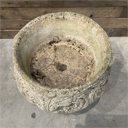 Cast stone circular garden urn decorated with scrolling foliate relief pattern