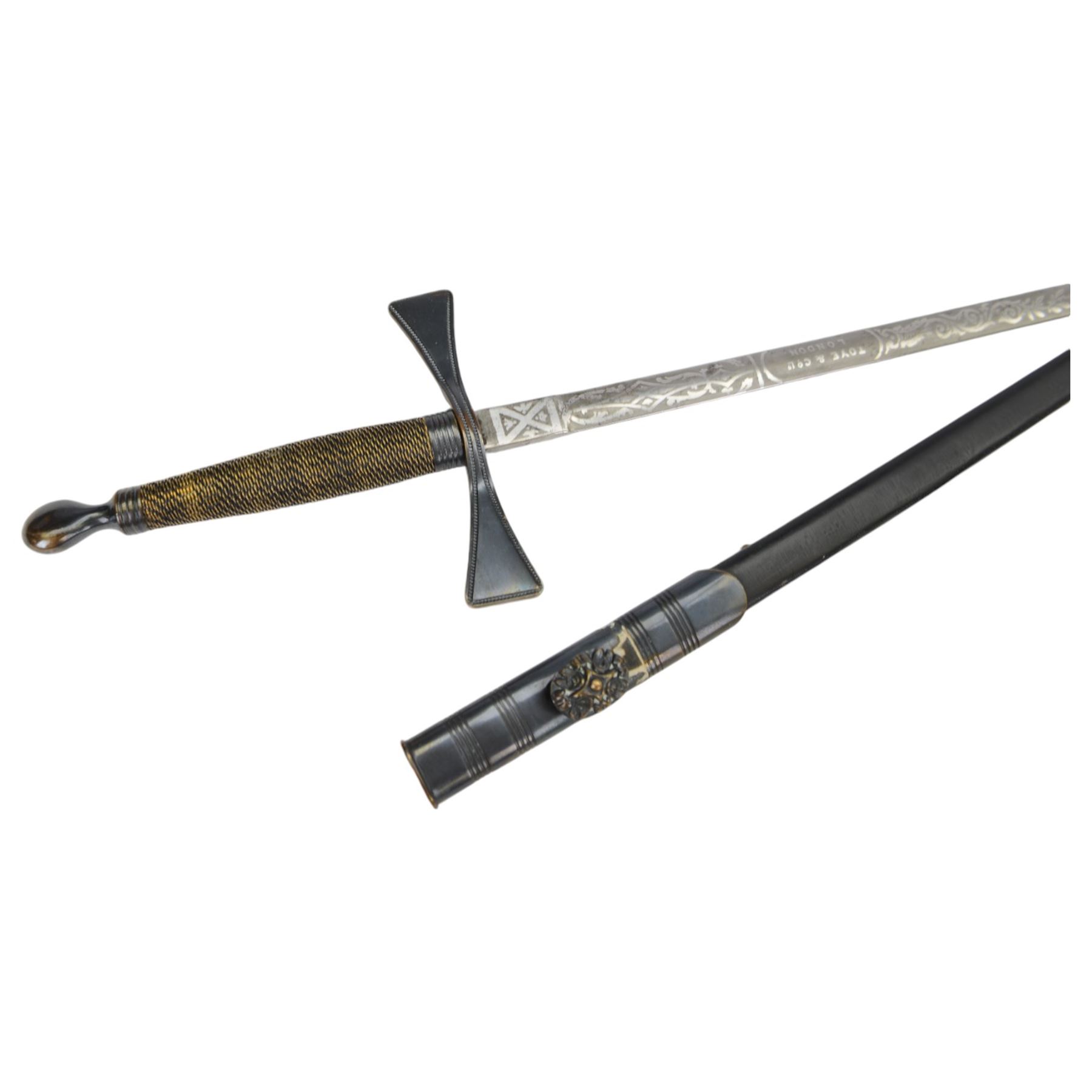 Masonic sword, blade decorated with scrolling motifs and marked for makers Toye & Co London, in metal scabbard, together with another masonic sword 