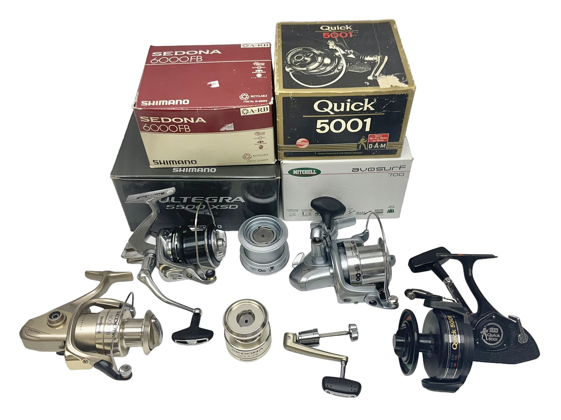 Four fixed spool reels, all in original boxes, comprising Shimano Ultegra  5500 XSD, with spare spool
