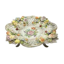 19th Meissen style centrepiece, with pierced lattice work sides and decorated in relief with fruit and floral sprigs, upon four scrolled feet, with spurious mark beneath H9cm D31cm