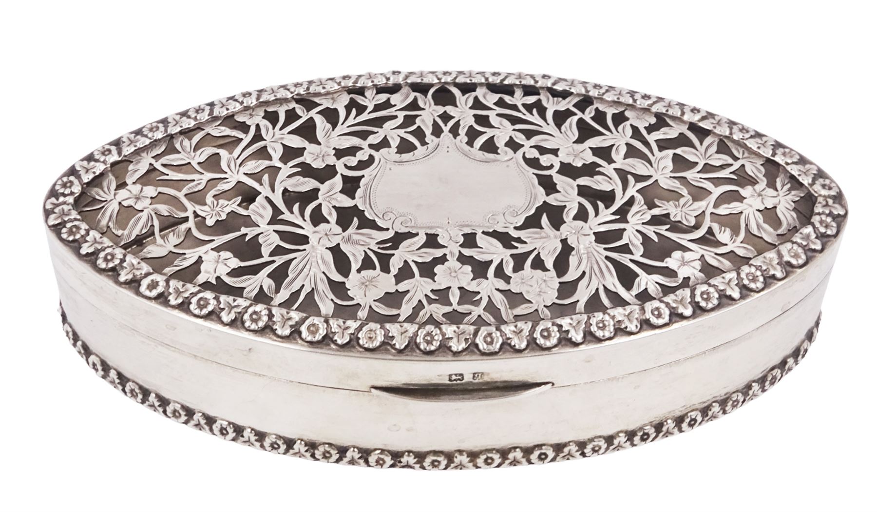 Edwardian silver trinket box, of navette form, the hinged cover with pierced floral and foliate decoration, and blank cartouche, hallmarked George Nathan & Ridley Hayes, Birmingham 1915 and stamped to base Pearce & Sons Silversmiths Leeds & York, W15.5cm, H3.5cm, 